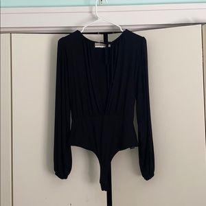 Black, open chested body suit